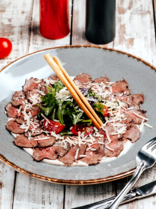 meat-carpaccio-with-vegetables-on-the-table