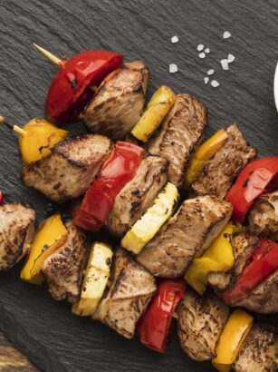 top-view-delicious-kebab-slate-with-salad-ketchup